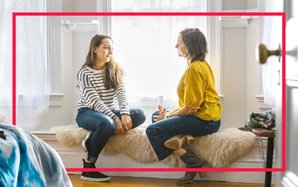 mother-teenage-daughter-talking-on-sofa